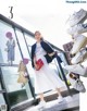 A woman standing in front of a window with a bunch of shoes.